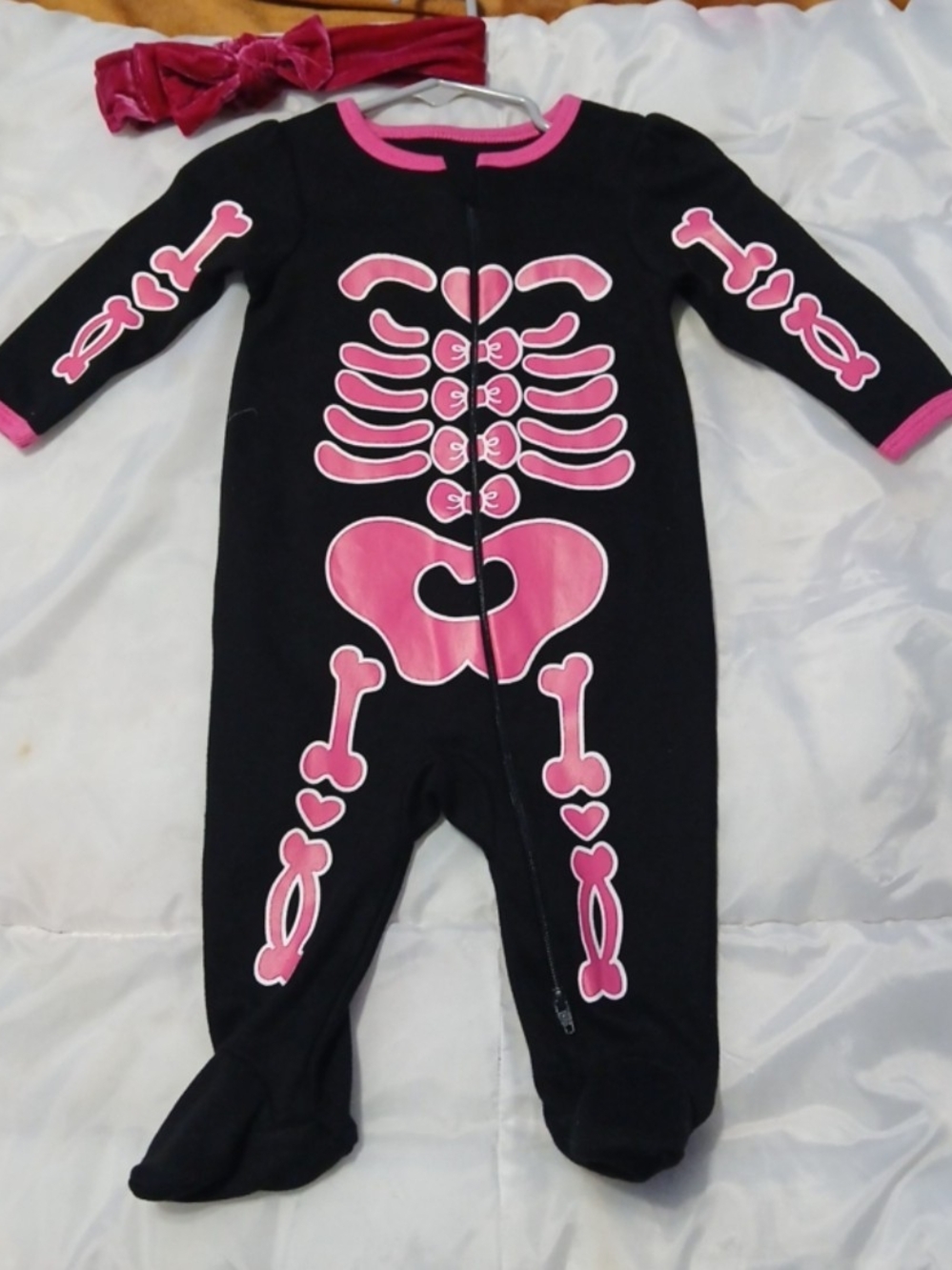 Kids Black One-Piece Footed Pajamas with Pink Skeleton Print